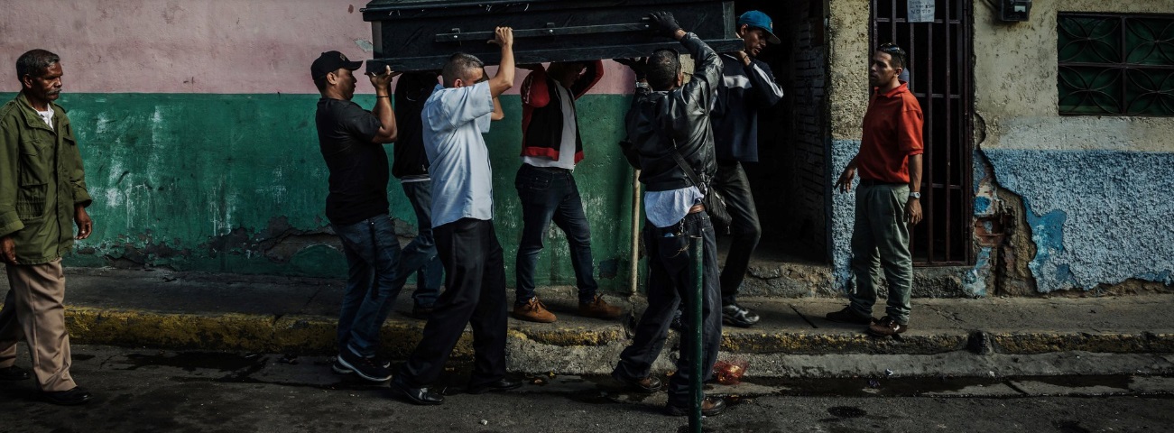 Pallbearers carried the coffin of Victor Martínez, 47, who died of tuberculosis last month in Petare, Venezuela. Credit Meridith Kohut for The New York Times