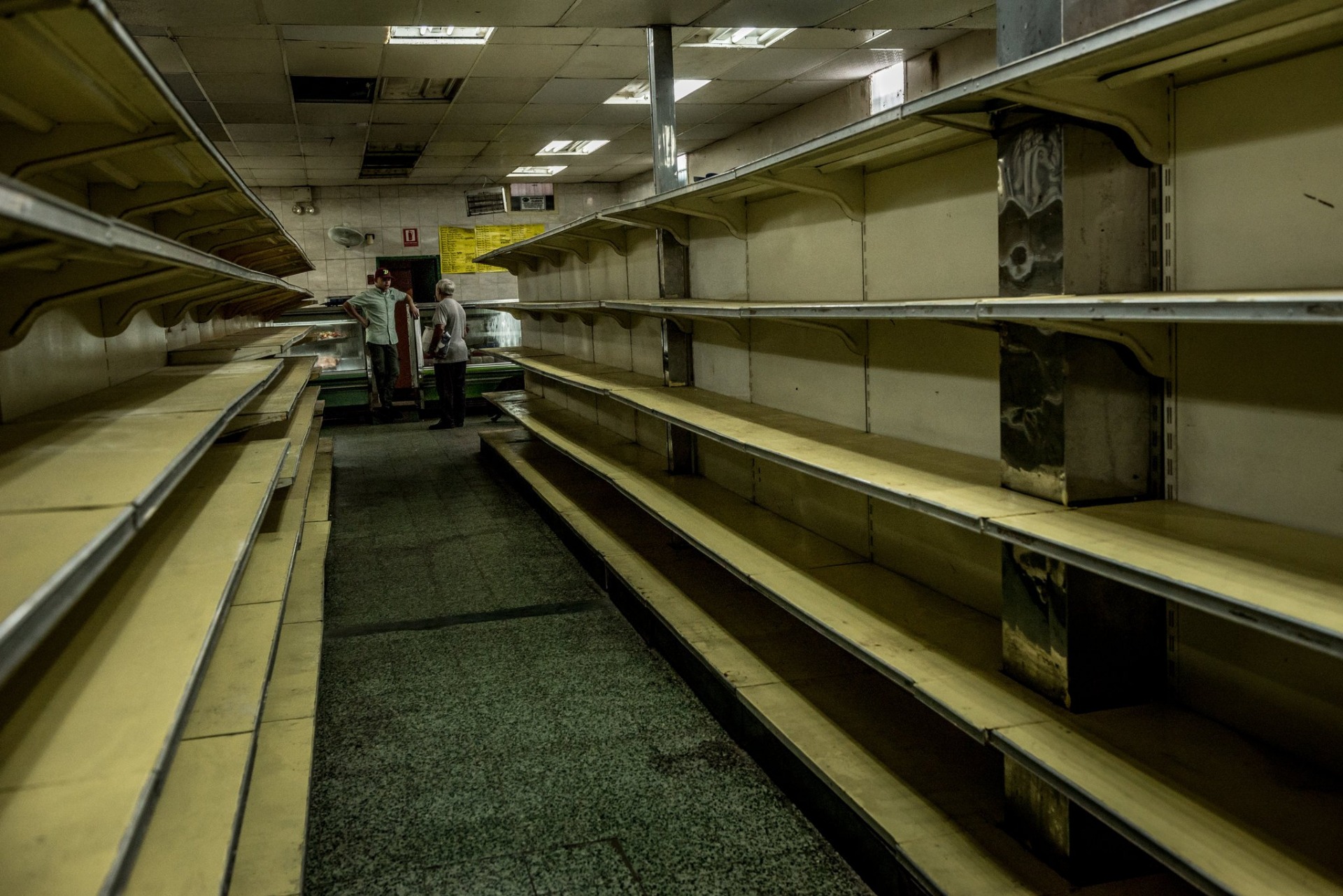 Food shortages have led to empty supermarket shelves in Venezuela, including these in Guaicaipuro